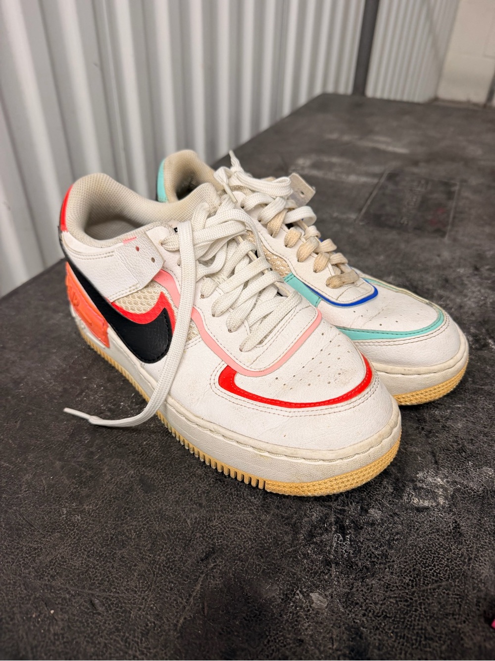 Nike women’s 8 us size White Sneakers with Black Swoosh and Multicolor Accents